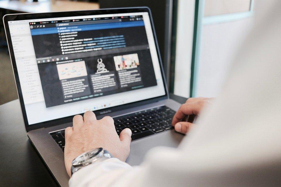 marketer working on his laptop