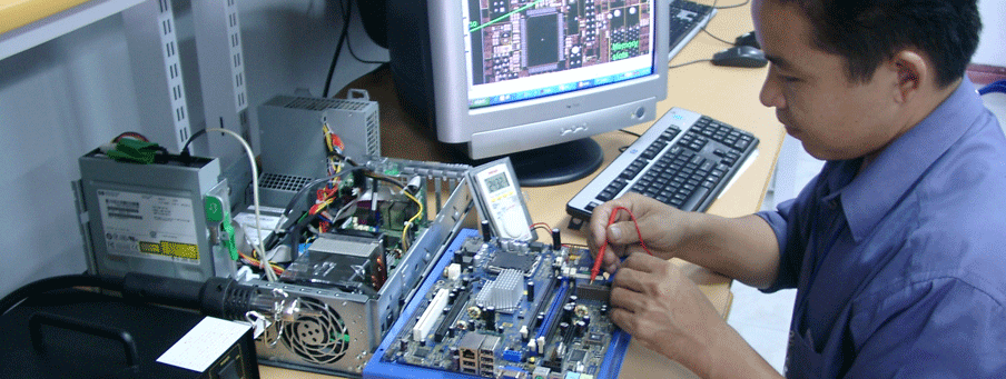 A hardware engineer works with computer devices